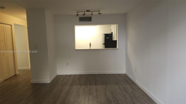 1720 NW N River Dr Unit 113, Miami, FL 33125 - empty room with dark wood-style floors and baseboards