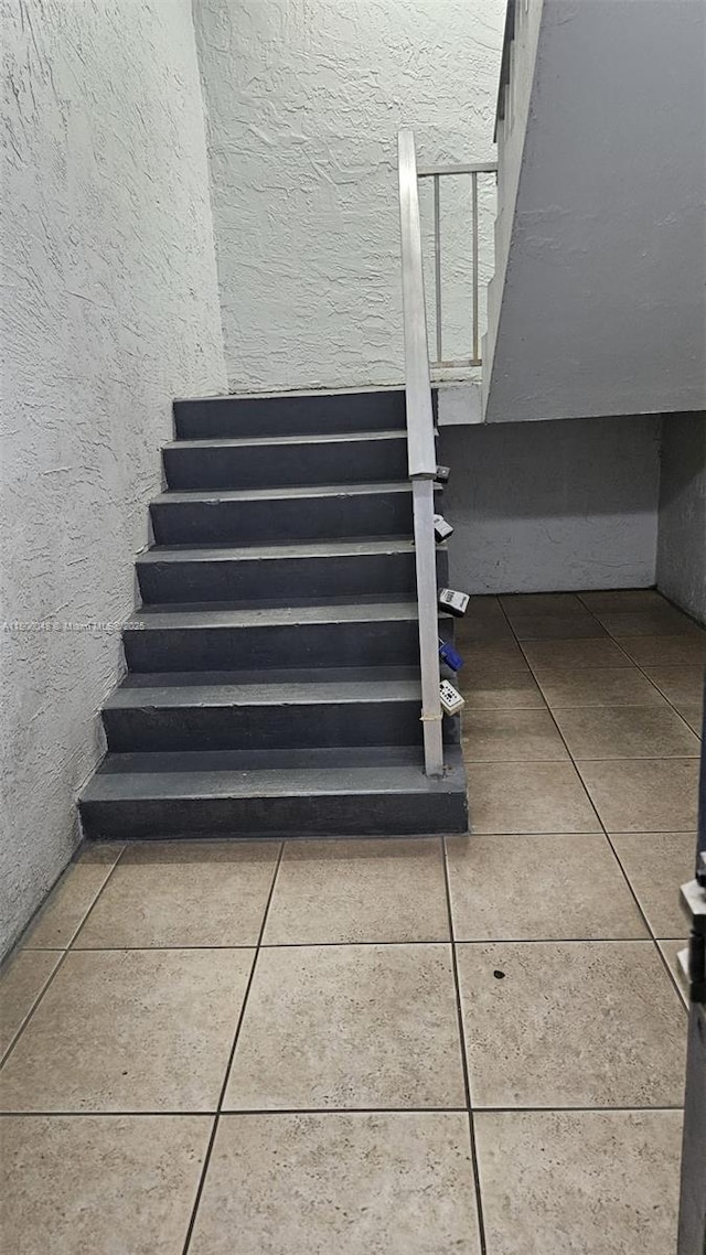 1720 NW N River Dr Unit 113, Miami, FL 33125 - staircase featuring tile patterned floors