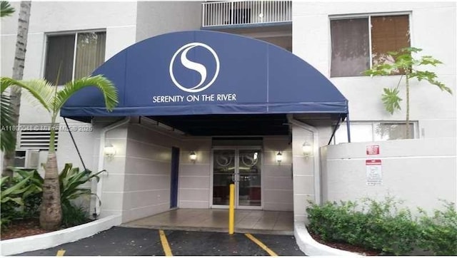 1720 NW N River Dr Unit 113, Miami, FL 33125 - property entrance with stucco siding