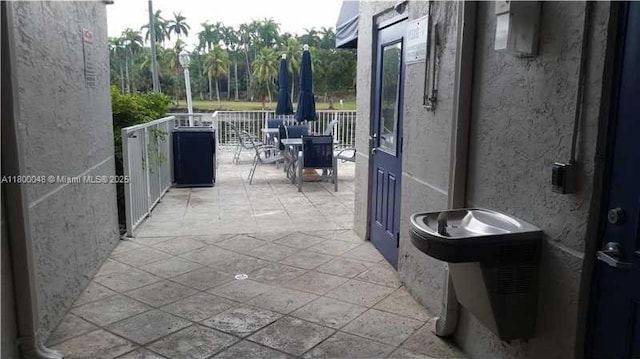 1720 NW N River Dr Unit 113, Miami, FL 33125 - view of patio featuring outdoor dining area