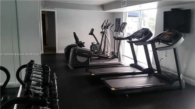1720 NW N River Dr Unit 113, Miami, FL 33125 - exercise room featuring baseboards