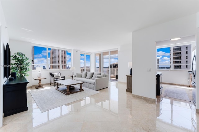 living area featuring baseboards