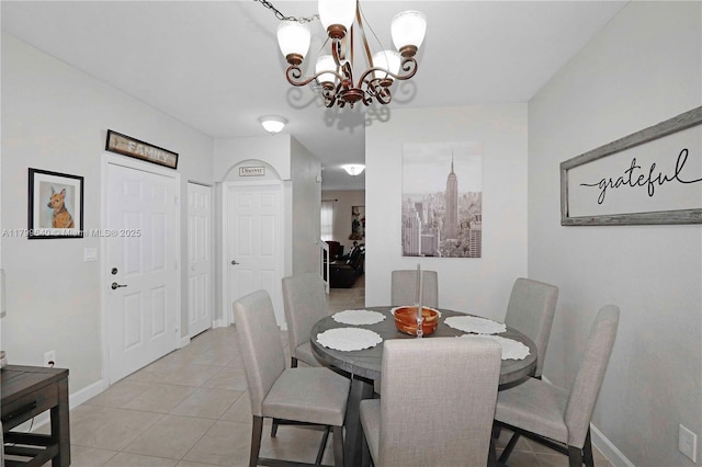 8897 SW 229th St, Cutler Bay, FL 33190 - dining room with light tile patterned flooring, a chandelier, and baseboards