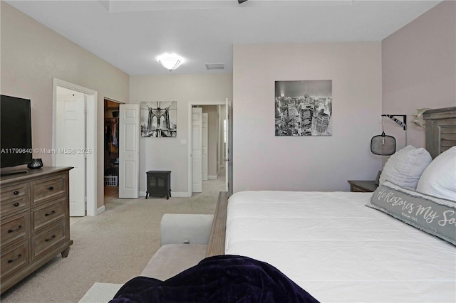 8897 SW 229th St, Cutler Bay, FL 33190 - bedroom featuring light colored carpet, a walk in closet, and baseboards