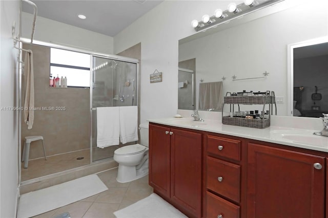 8897 SW 229th St, Cutler Bay, FL 33190 - bathroom with toilet, double vanity, tile patterned flooring, and a stall shower