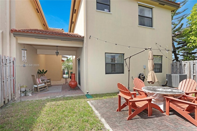 8897 SW 229th St, Cutler Bay, FL 33190 - rear view of house featuring stucco siding, a patio area, central AC unit, and a tile roof