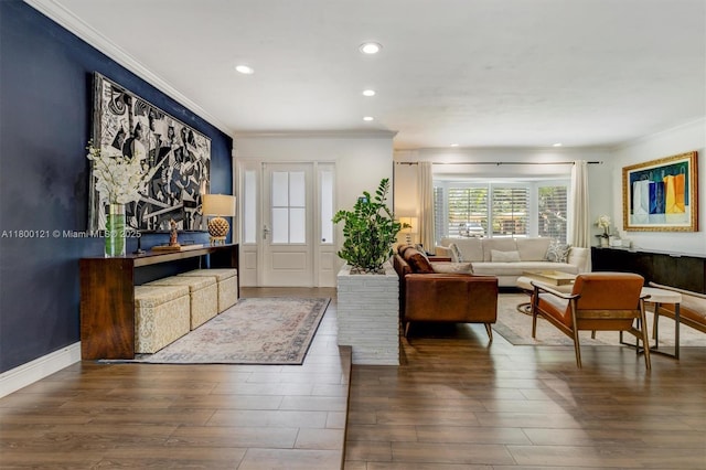 living room featuring ornamental molding, wood finished floors, and recessed lighting