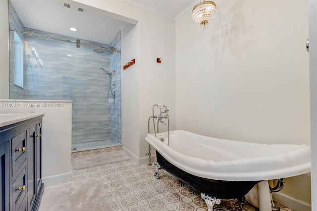 bathroom featuring crown molding, a shower stall, a freestanding bath, baseboards, and vanity