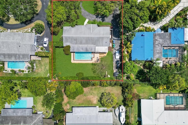 view of property location featuring a pool and property parcel outlined