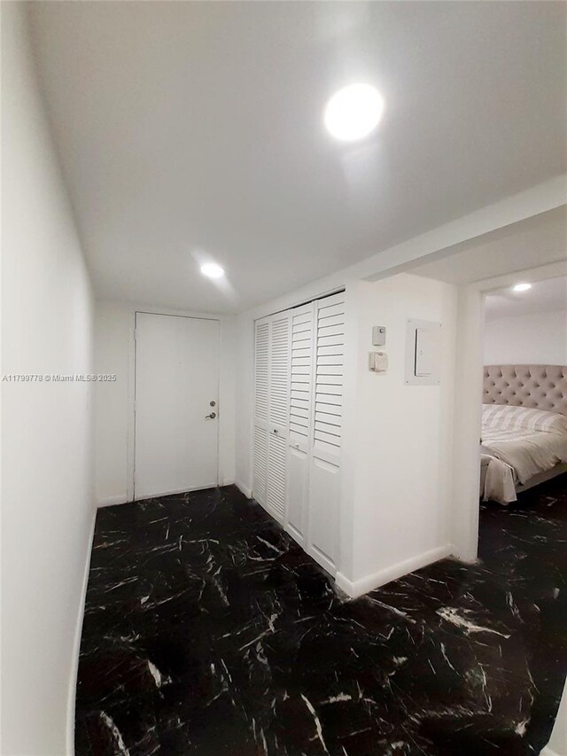 16023 S Fairway Ter Unit 118, Weston, FL 33326 - hallway featuring recessed lighting, dark marble finish flooring, and electric panel