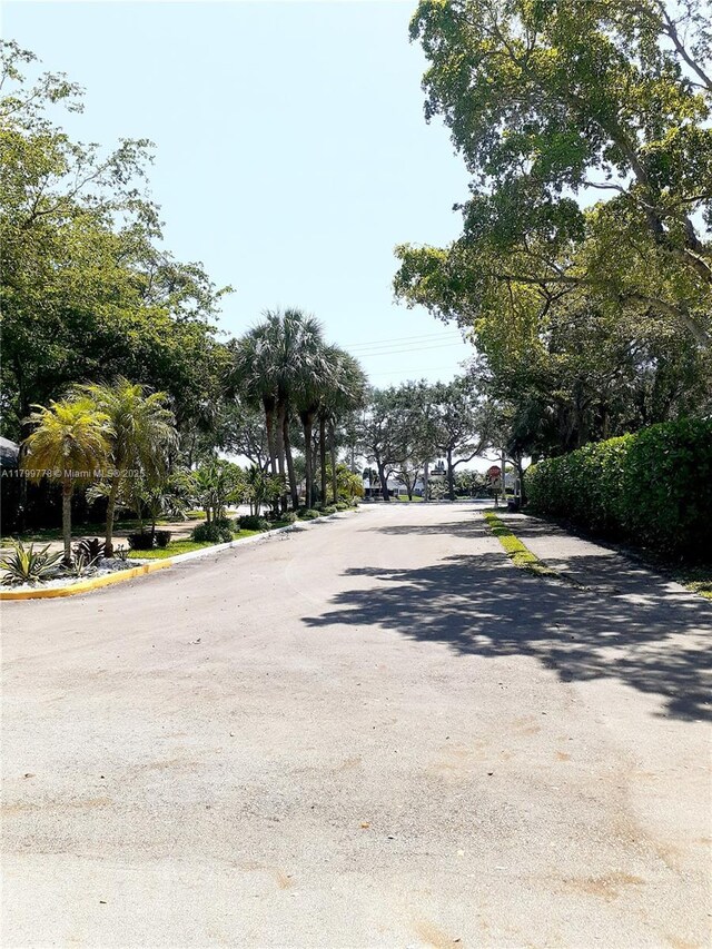 16023 S Fairway Ter Unit 118, Weston, FL 33326 - view of asphalt road featuring curbs