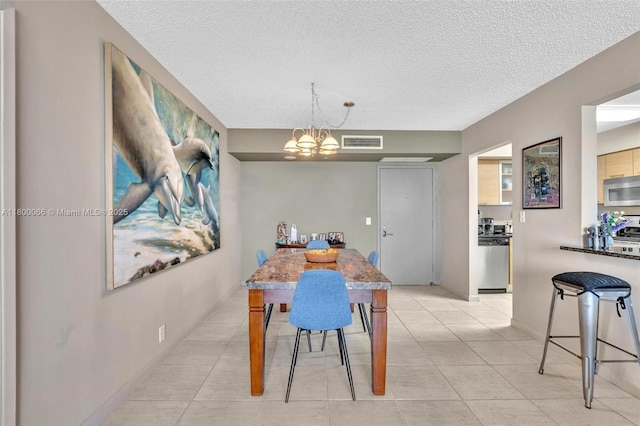 3300 NE 191st St Unit Lp04, Aventura, FL 33180 - dining area featuring a chandelier, a textured ceiling, and light tile patterned floors