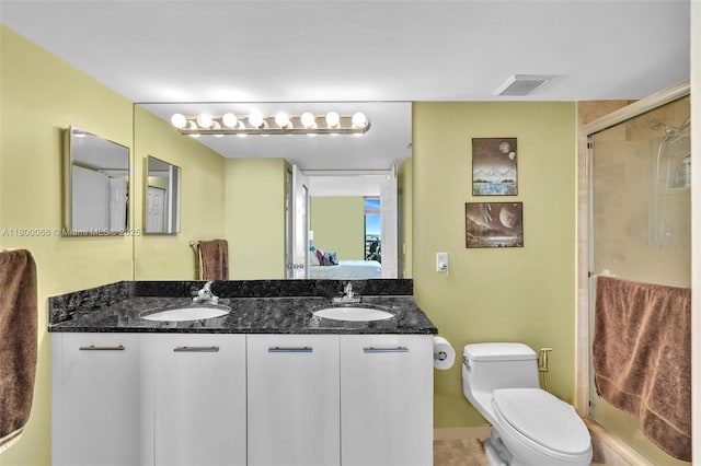 3300 NE 191st St Unit Lp04, Aventura, FL 33180 - ensuite bathroom featuring double vanity, a shower stall, and toilet