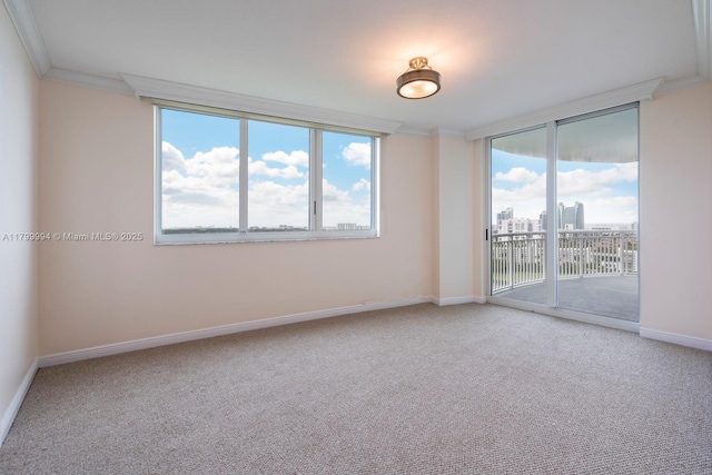 1745 E Hallandale Beach Blvd Unit 1903W, Hallandale Beach, FL 33009 - empty room featuring crown molding, carpet floors, baseboards, and a view of city