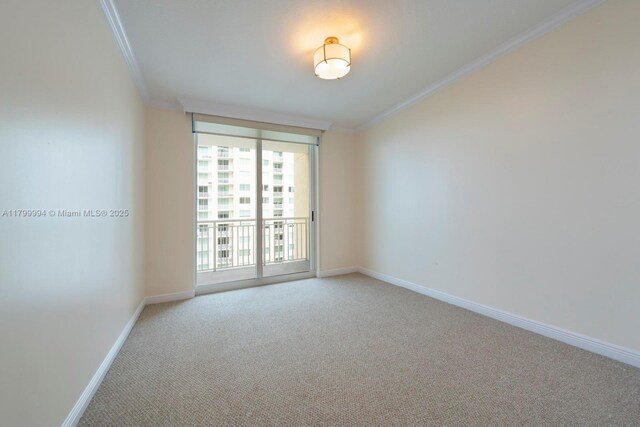 1745 E Hallandale Beach Blvd Unit 1903W, Hallandale Beach, FL 33009 - empty room with crown molding, light carpet, baseboards, and expansive windows