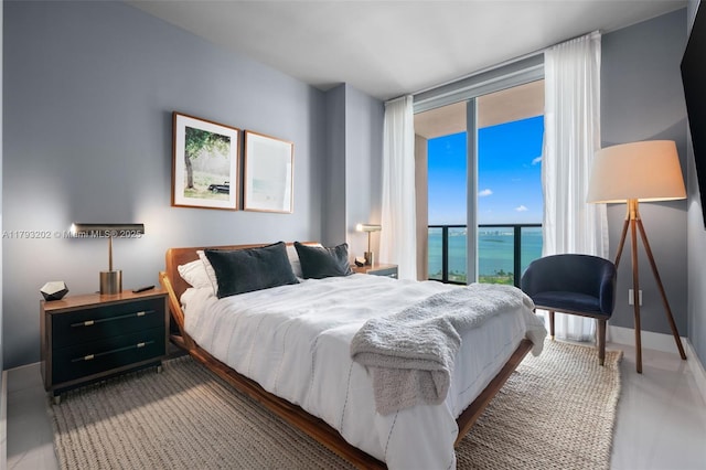 501 NE 31st St Unit 2906, Miami, FL 33137 - bedroom with access to outside and a wall of windows