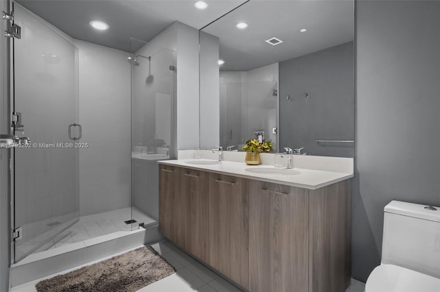 501 NE 31st St Unit 2906, Miami, FL 33137 - full bathroom with toilet, a stall shower, tile patterned flooring, double vanity, and recessed lighting