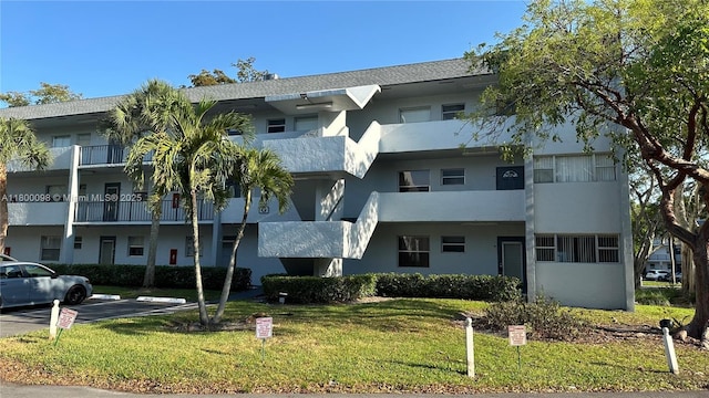 8360 Sands Point Blvd Unit G209, Tamarac, FL 33321 - view of property featuring uncovered parking