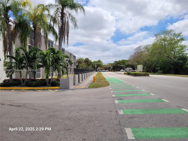 14140 SW 84th St Unit 301-H, Miami, FL 33183 - view of asphalt road with sidewalks and curbs