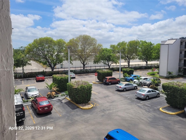 14140 SW 84th St Unit 301-H, Miami, FL 33183 - uncovered parking lot with fence
