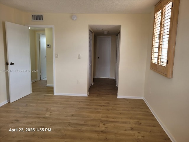 14140 SW 84th St Unit 301-H, Miami, FL 33183 - unfurnished room with wood finished floors, baseboards, and a smoke detector