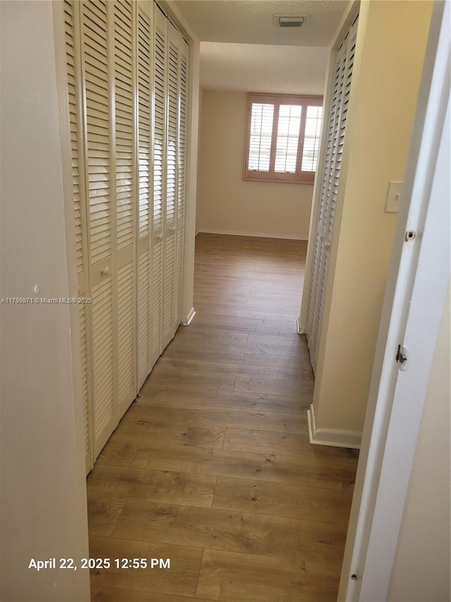 14140 SW 84th St Unit 301-H, Miami, FL 33183 - hallway with baseboards and wood finished floors
