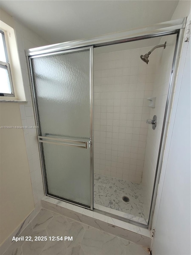 14140 SW 84th St Unit 301-H, Miami, FL 33183 - bathroom featuring a shower stall and marble look tiles