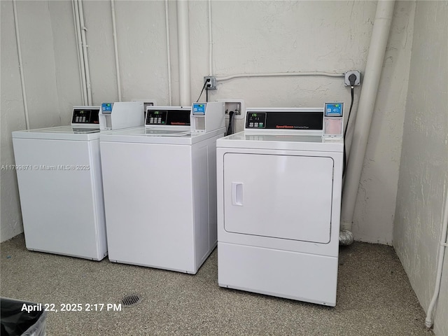 14140 SW 84th St Unit 301-H, Miami, FL 33183 - community laundry with separate washer and dryer and a textured wall