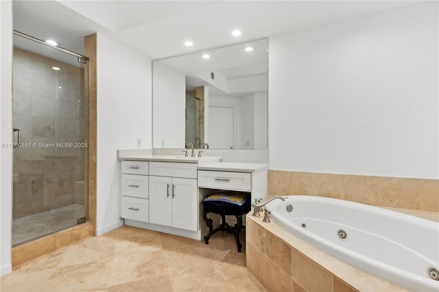 full bath featuring a stall shower, recessed lighting, a whirlpool tub, and vanity