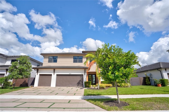9015 NW 161st Ter, Miami Lakes, FL 33018 - view of front of home featuring a garage, driveway, and stucco siding