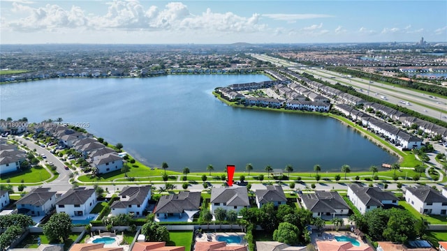 9015 NW 161st Ter, Miami Lakes, FL 33018 - aerial perspective of suburban area with a nearby body of water