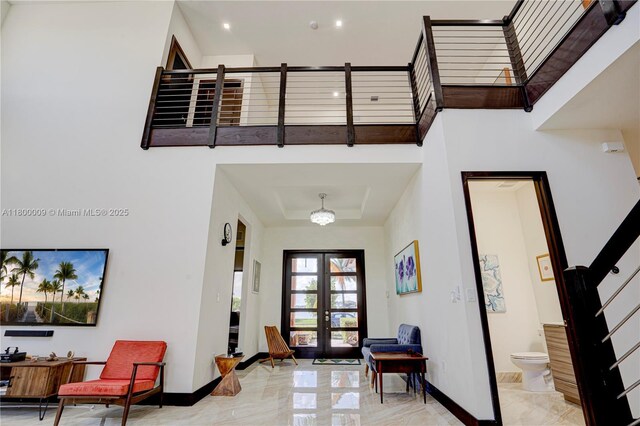 9015 NW 161st Ter, Miami Lakes, FL 33018 - entryway featuring stairway, baseboards, marble tiled flooring, french doors, and a high ceiling