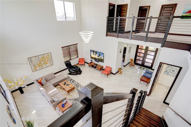 9015 NW 161st Ter, Miami Lakes, FL 33018 - living area with a towering ceiling and baseboards