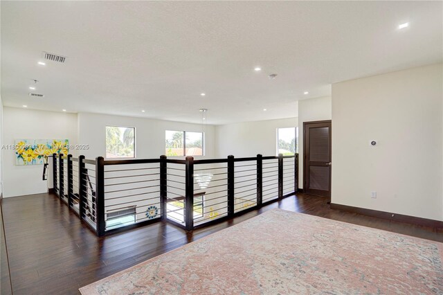 9015 NW 161st Ter, Miami Lakes, FL 33018 - corridor with wood finished floors, recessed lighting, baseboards, and an upstairs landing
