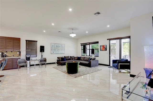 9015 NW 161st Ter, Miami Lakes, FL 33018 - living area featuring light marble finish flooring, recessed lighting, and baseboards