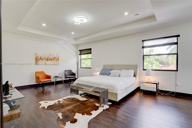 9015 NW 161st Ter, Miami Lakes, FL 33018 - bedroom with a raised ceiling, hardwood / wood-style flooring, recessed lighting, and baseboards