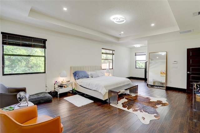 9015 NW 161st Ter, Miami Lakes, FL 33018 - bedroom with a tray ceiling, hardwood / wood-style floors, recessed lighting, and baseboards