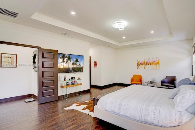 9015 NW 161st Ter, Miami Lakes, FL 33018 - bedroom with a tray ceiling, baseboards, dark wood-style flooring, and recessed lighting