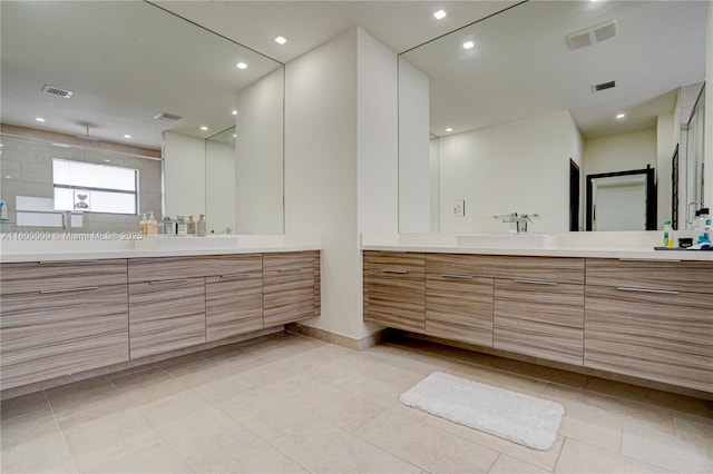 9015 NW 161st Ter, Miami Lakes, FL 33018 - bathroom featuring tile patterned flooring, two vanities, a shower stall, recessed lighting, and baseboards