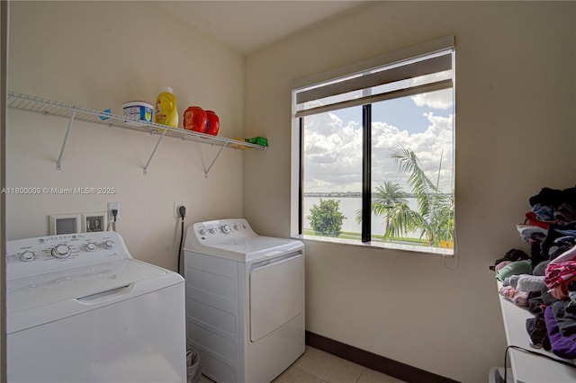 9015 NW 161st Ter, Miami Lakes, FL 33018 - clothes washing area with separate washer and dryer, light tile patterned flooring, and baseboards
