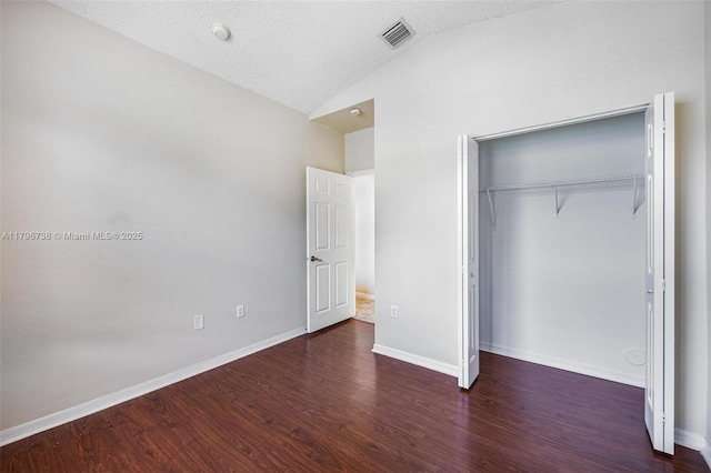 2252 NE 42nd Cir, Homestead, FL 33033 - unfurnished bedroom featuring vaulted ceiling, wood finished floors, baseboards, and a closet