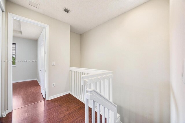 2252 NE 42nd Cir, Homestead, FL 33033 - corridor featuring an upstairs landing, wood finished floors, and baseboards