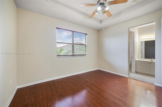 2252 NE 42nd Cir, Homestead, FL 33033 - unfurnished room with light wood-style flooring, a textured ceiling, ceiling fan, and baseboards