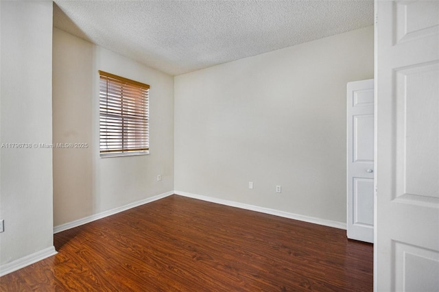2252 NE 42nd Cir, Homestead, FL 33033 - unfurnished room with wood finished floors, a textured ceiling, and baseboards
