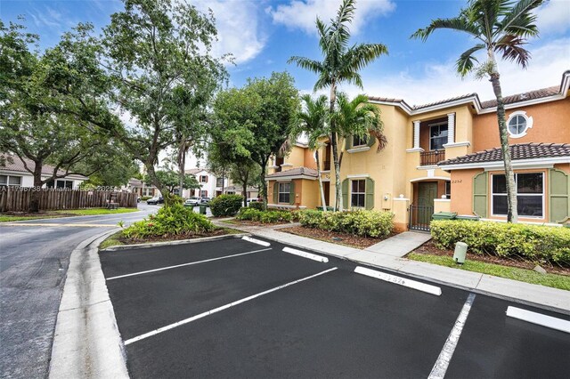 2252 NE 42nd Cir, Homestead, FL 33033 - uncovered parking lot with fence, a gate, and a residential view