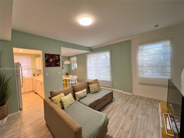 1614 Pennsylvania Ave Unit 2I, Miami Beach, FL 33139 - living room with light wood-style floors and baseboards