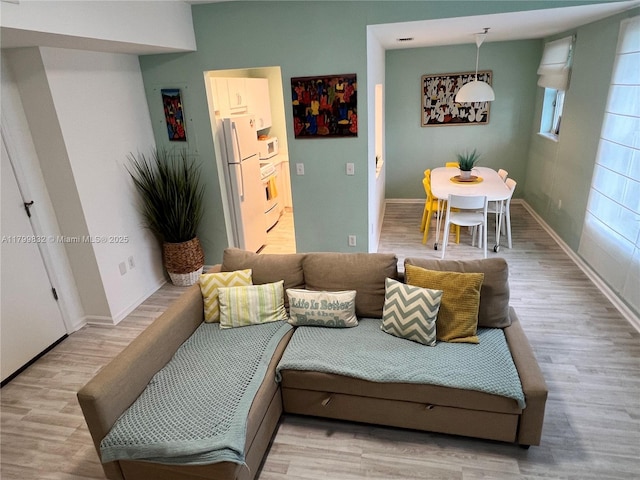 1614 Pennsylvania Ave Unit 2I, Miami Beach, FL 33139 - living room with light wood-type flooring and baseboards