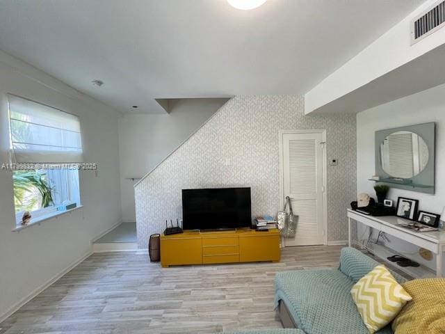 1614 Pennsylvania Ave Unit 2I, Miami Beach, FL 33139 - living area featuring light wood-type flooring and baseboards