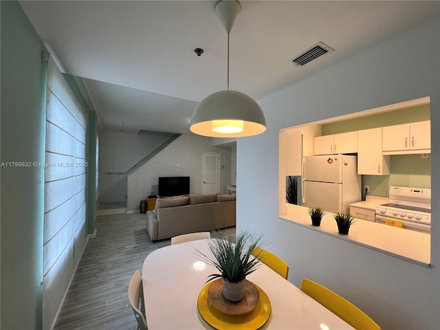 1614 Pennsylvania Ave Unit 2I, Miami Beach, FL 33139 - dining room with dark wood-style floors and baseboards