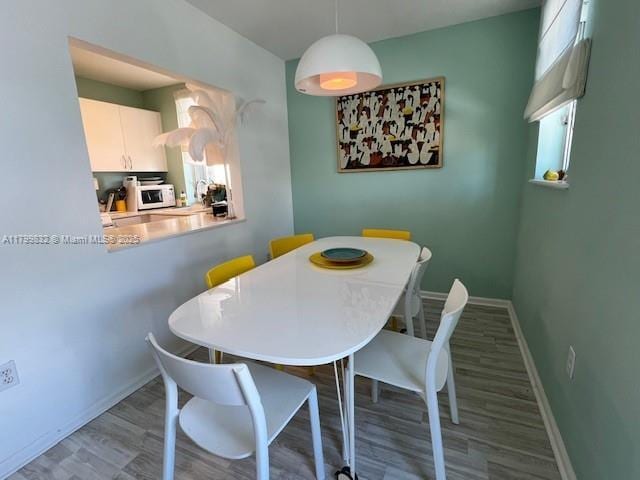 1614 Pennsylvania Ave Unit 2I, Miami Beach, FL 33139 - dining space with wood finished floors and baseboards